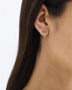 Stunning Baguette Channel-Set Huggie Earrings.