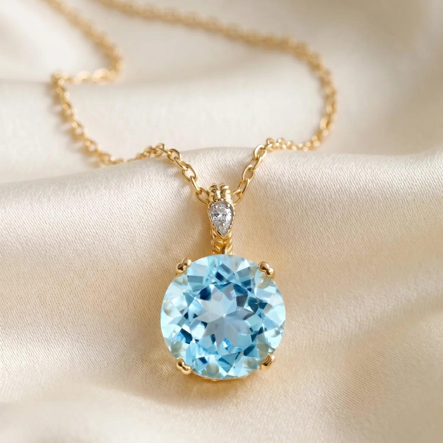 Stunning 14K Yellow Gold Sky Blue Topaz and Diamond Pendant.