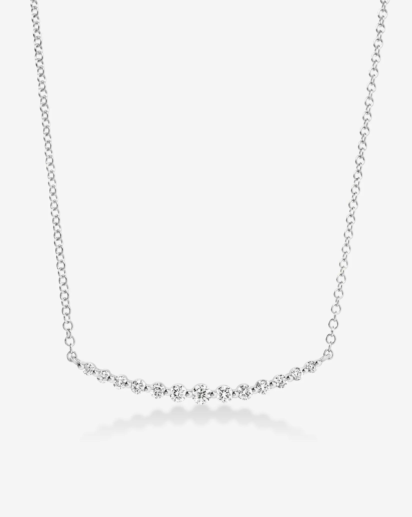 Exquisite Graduated Single Prong Diamond Necklace for Timeless Elegance.