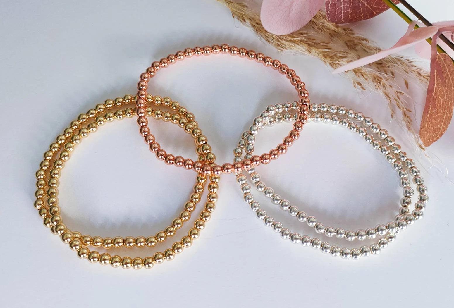 Elegant Gold Rose Silver Beaded Stacking Bracelets - 14K Gold Plated Elastic Design.