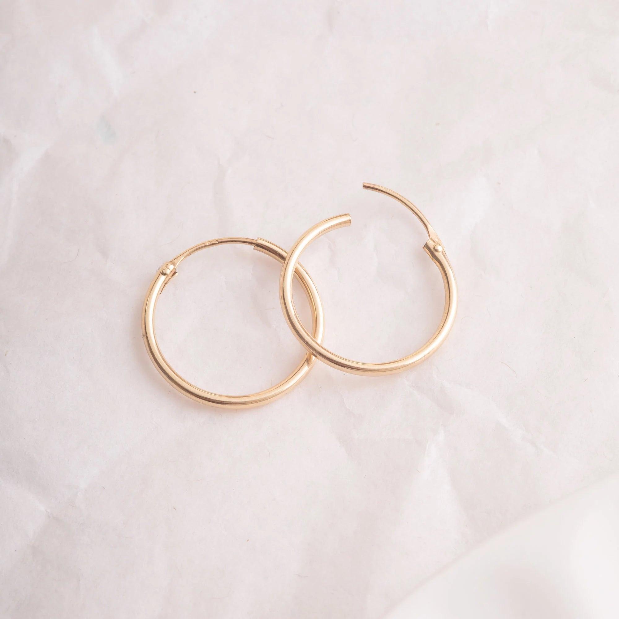 Elegant 14K Gold Hoop Earrings - Dainty Thin Wire Hoops in Small, Medium, and Large for Everyday Wear.