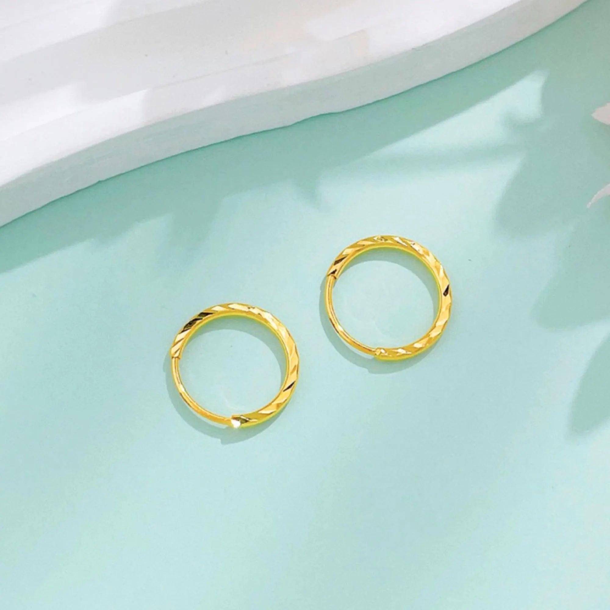 Luxurious 24K Gold Minimalist Wave Hoop Earrings for Elegant Women.
