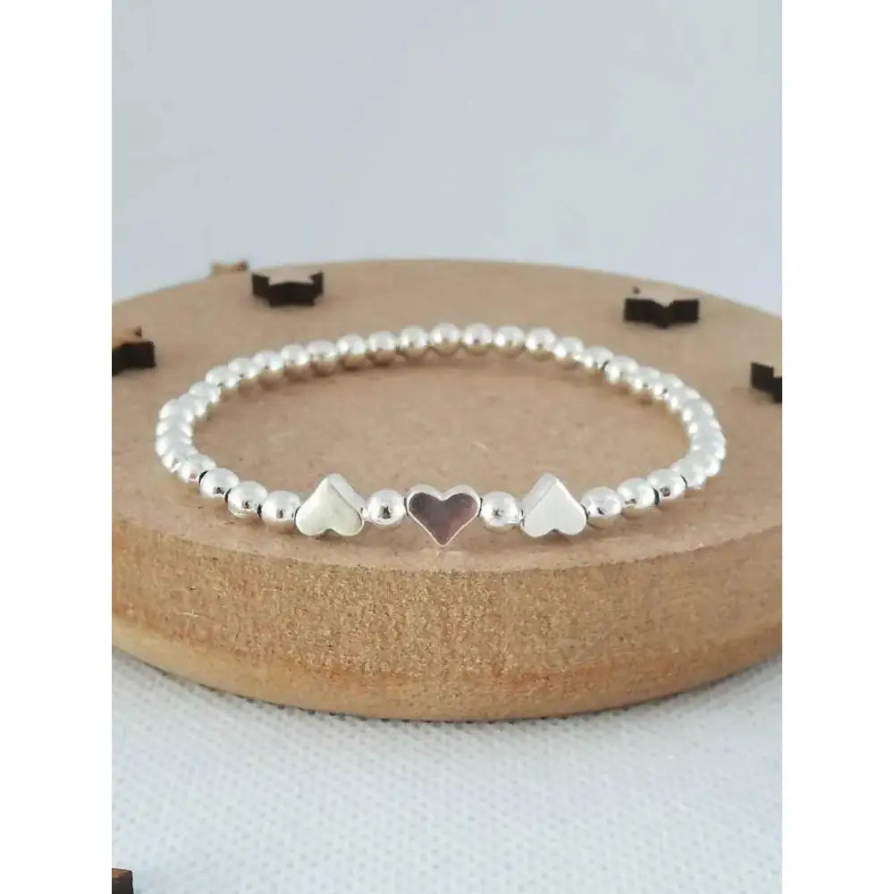 Charming Silver Heart Stretch Bracelet - Perfect Beaded Stacking Gift for Girlfriend or Teacher.