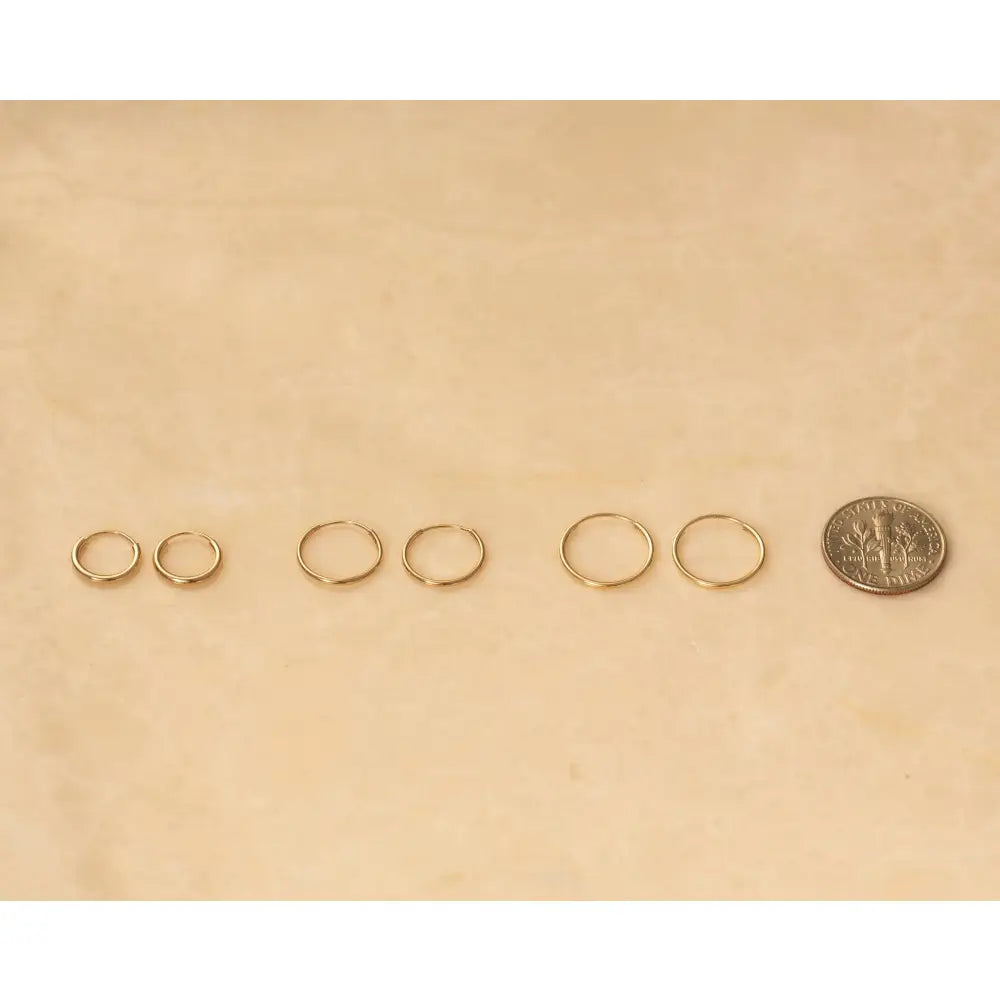 Chic 14K Solid Gold Endless Hoop Earrings - Elegant Tiny Huggie Hoops for Every Occasion.