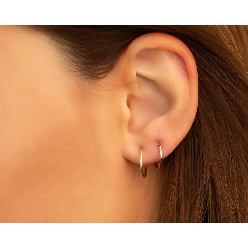Chic 14K Solid Gold Endless Hoop Earrings - Elegant Tiny Huggie Hoops for Every Occasion.