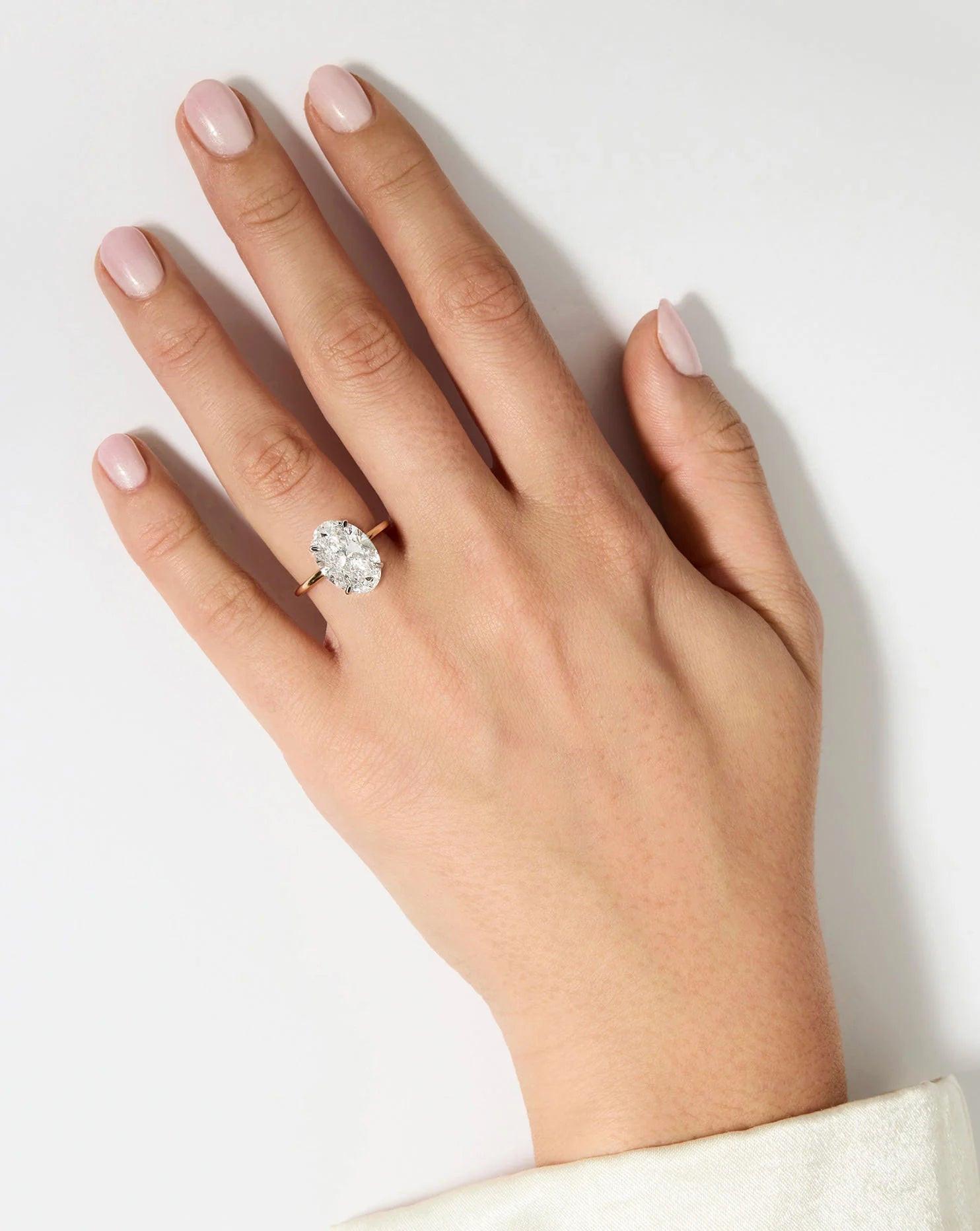 Stunning 5.63ct Oval Lab Diamond with Whisper Thin® Hidden Halo - A Perfect Elegance.
