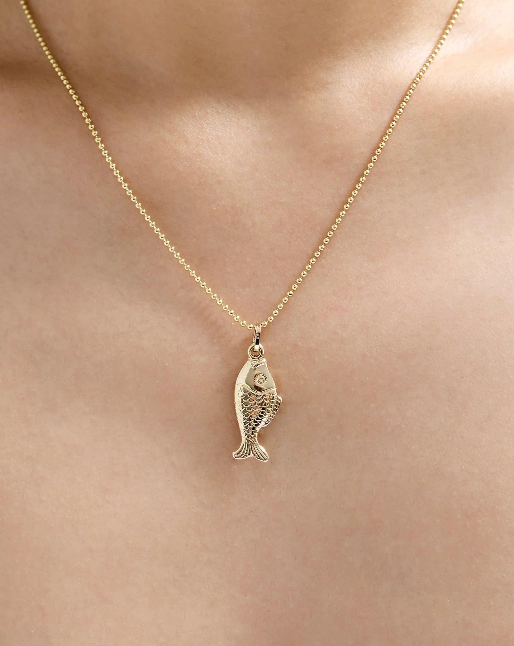Exquisite Golden Catch Pendant - A Timeless Treasure.