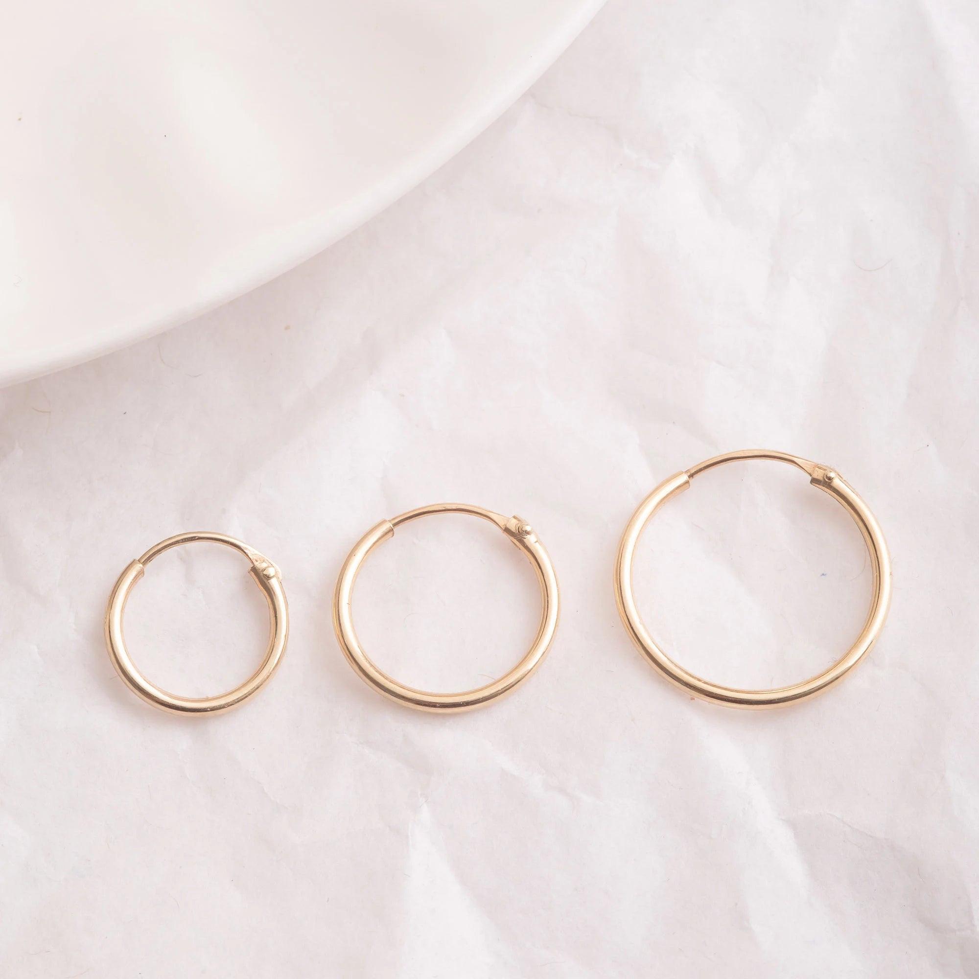 Elegant 14K Gold Hoop Earrings - Dainty Thin Wire Hoops in Small, Medium, and Large for Everyday Wear.