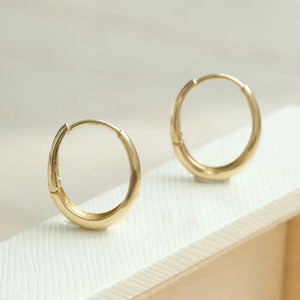 Dainty 14K Solid Gold Oval Hoop Earrings - Minimalist Skinny Huggie Hoops for Everyday Elegance.
