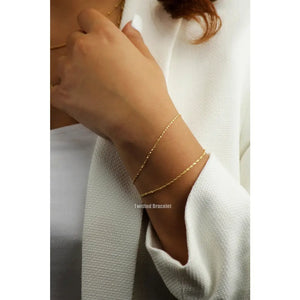 Elegant 10K Solid Gold Twisted Chain Bracelet - Dainty and Stackable Everyday Essential for Women.