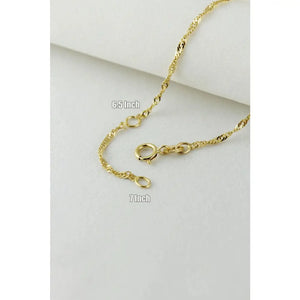 Elegant 10K Solid Gold Twisted Chain Bracelet - Dainty and Stackable Everyday Essential for Women.