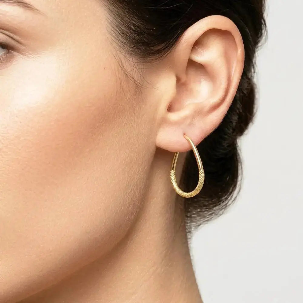 Elegant 10K Yellow Gold Textured Oval Hoop Earrings - Timeless Everyday Style.