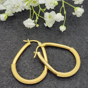 Elegant 10K Yellow Gold Textured Oval Hoop Earrings - Timeless Everyday Style.