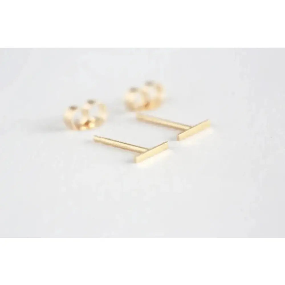 Elegant 14K Gold Bar Stud Earrings - Tiny Solid Gold Minimalist Jewelry for Everyday Wear.