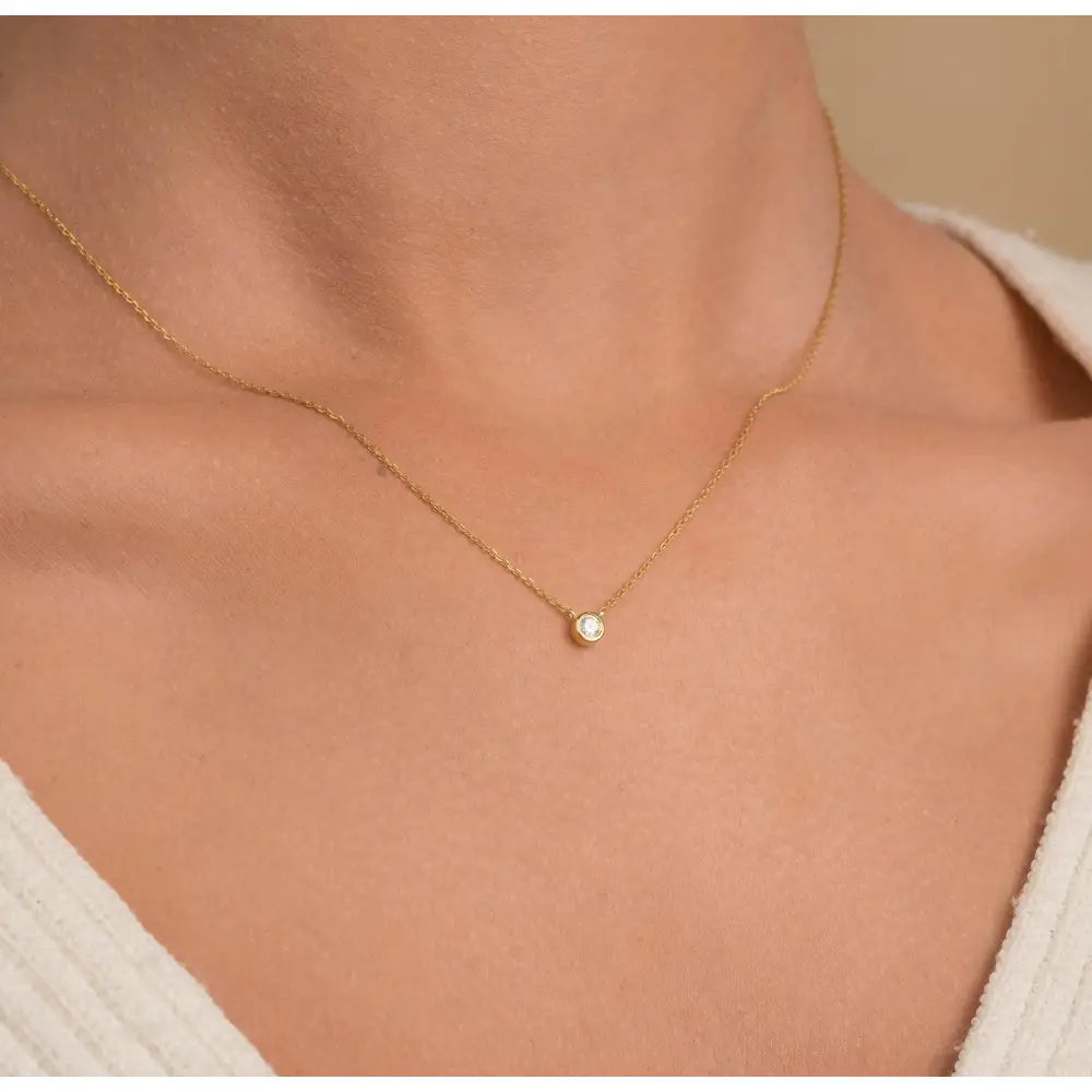 Elegant 14K Gold Diamond Solitaire Necklace - Minimalist Bezel Setting for Timeless Style.