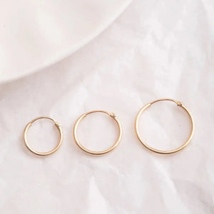 Elegant 14K Gold Hoop Earrings - Dainty Thin Wire Hoops in Small, Medium, and Large for Everyday Wear.