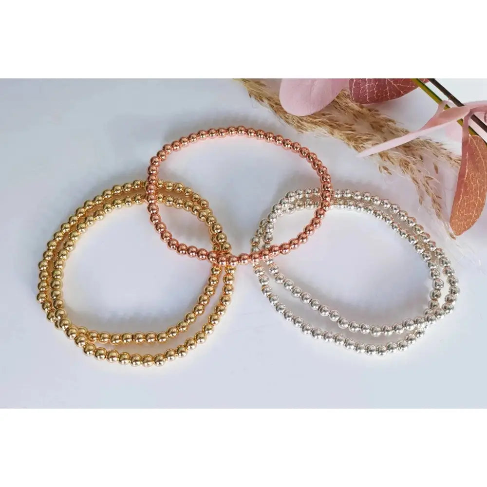 Elegant Gold Rose Silver Beaded Stacking Bracelets - 14K Gold Plated Elastic Design.