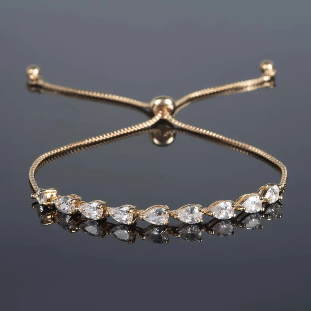 Elegant Gold Slider Bracelet with Dainty Pear-Shaped Cubic Zirconia for Women and Girls.