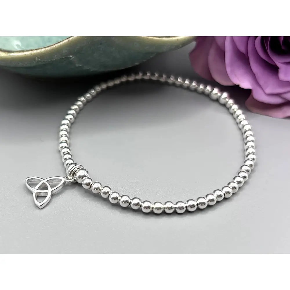 Elegant Sterling Silver Celtic Trinity Knot Bracelet with Trefoil Charm - Perfect Stacking Jewelry Gift.
