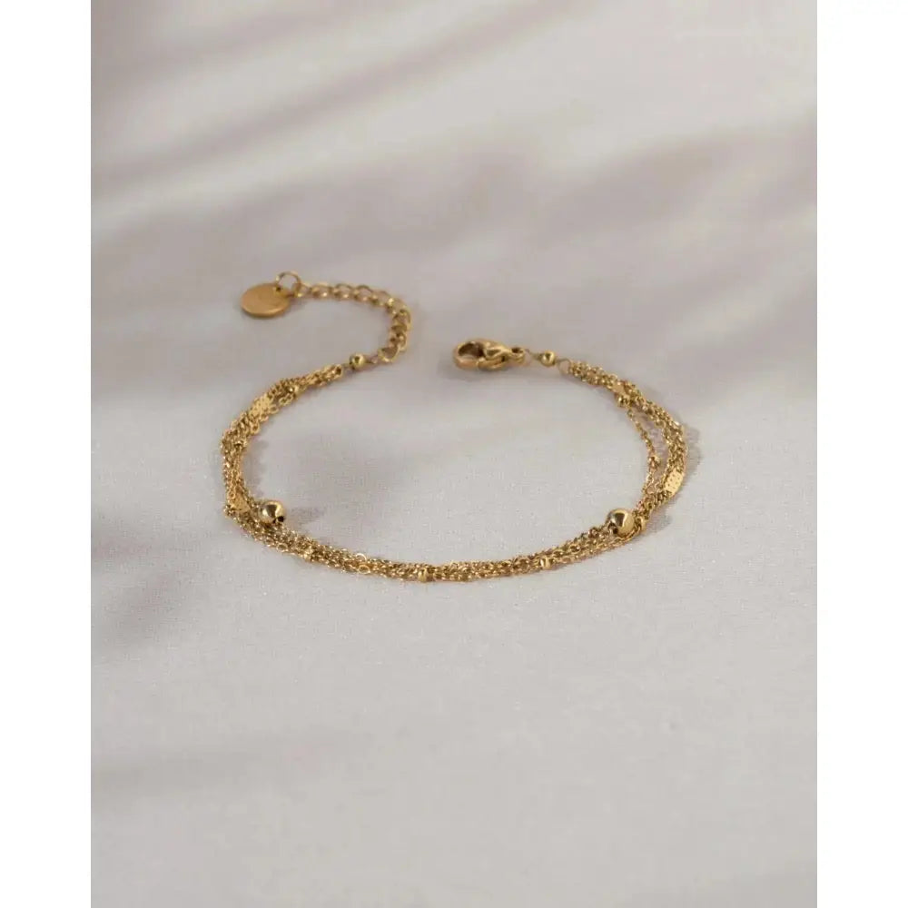 Elegant Waterproof Gold Stainless Steel Layered Bracelet - Dainty Stackable Design for Women.