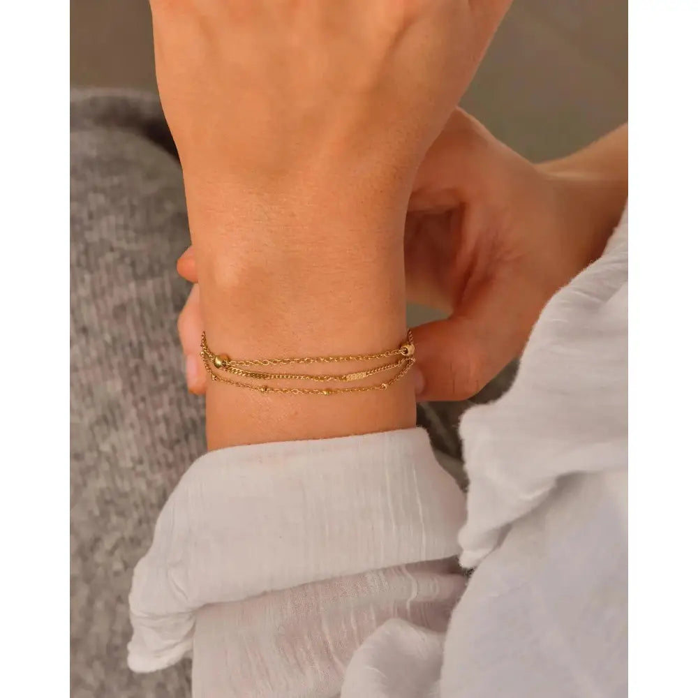 Elegant Waterproof Gold Stainless Steel Layered Bracelet - Dainty Stackable Design for Women.