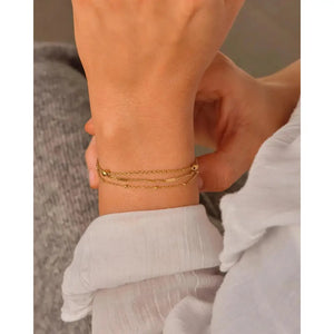 Elegant Waterproof Gold Stainless Steel Layered Bracelet - Dainty Stackable Design for Women.