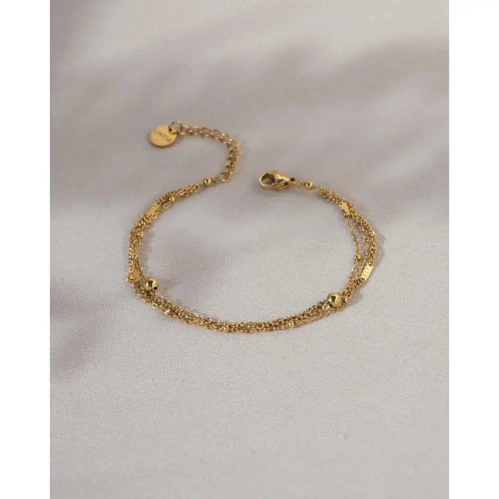 Elegant Waterproof Gold Stainless Steel Layered Bracelet - Dainty Stackable Design for Women.