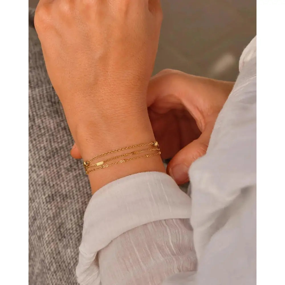 Elegant Waterproof Gold Stainless Steel Layered Bracelet - Dainty Stackable Design for Women.