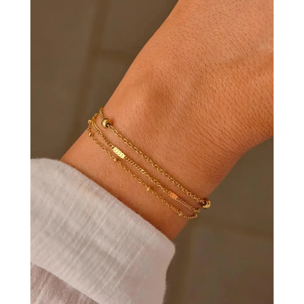 Elegant Waterproof Gold Stainless Steel Layered Bracelet - Dainty Stackable Design for Women.