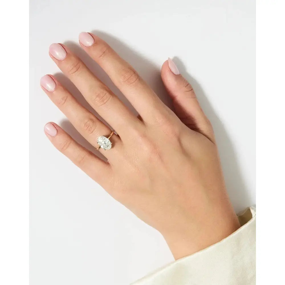 Exquisite 4.52 Carat Oval Lab Diamond with Whisper Thin® Hidden Halo Setting.