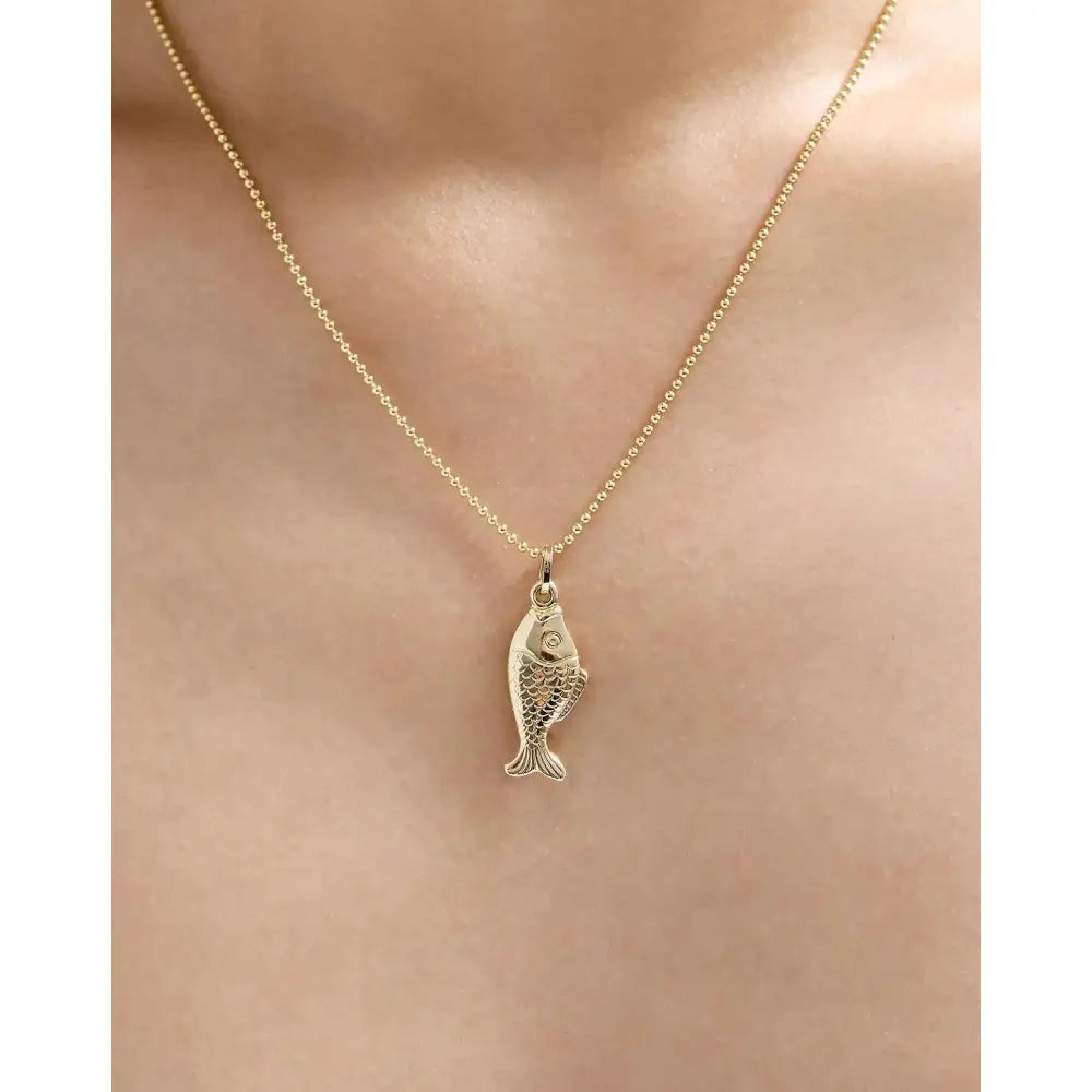 Exquisite Golden Catch Pendant - A Timeless Treasure.