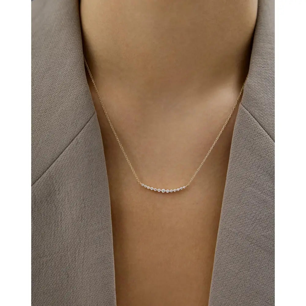 Exquisite Graduated Single Prong Diamond Necklace for Timeless Elegance.