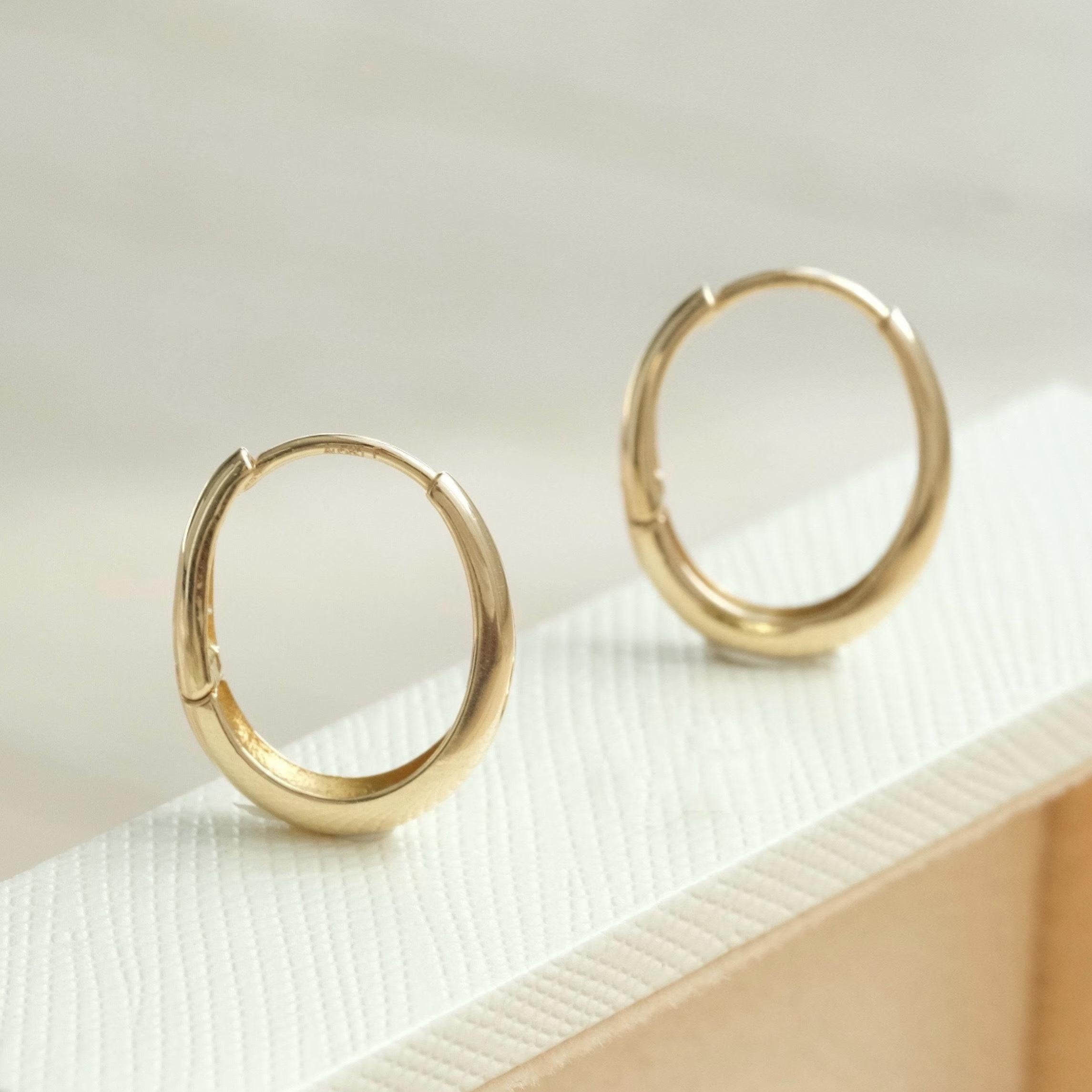 Dainty 14K Solid Gold Oval Hoop Earrings - Minimalist Skinny Huggie Hoops for Everyday Elegance.