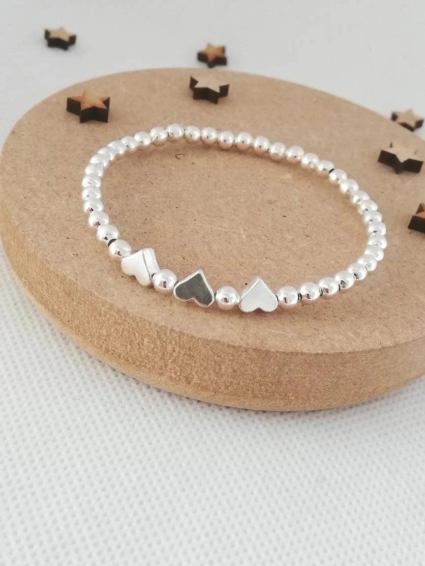 Charming Silver Heart Stretch Bracelet - Perfect Beaded Stacking Gift for Girlfriend or Teacher.