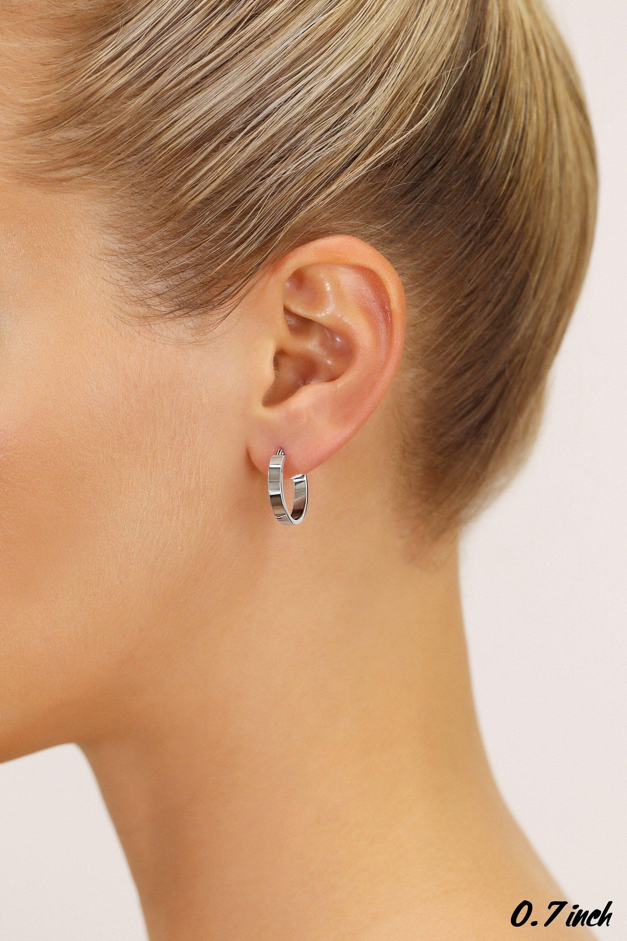 14K White Gold Elegant Small Oval Hoop Earrings - 0.7 Inch Classic Shine.