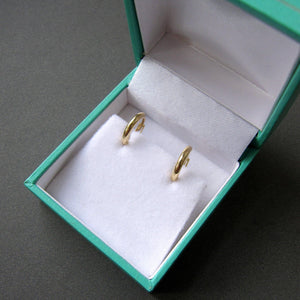 Stunning 14K Solid Gold Oval Hoop Earrings - Dainty Skinny Huggie Hoops for Elegant Women.