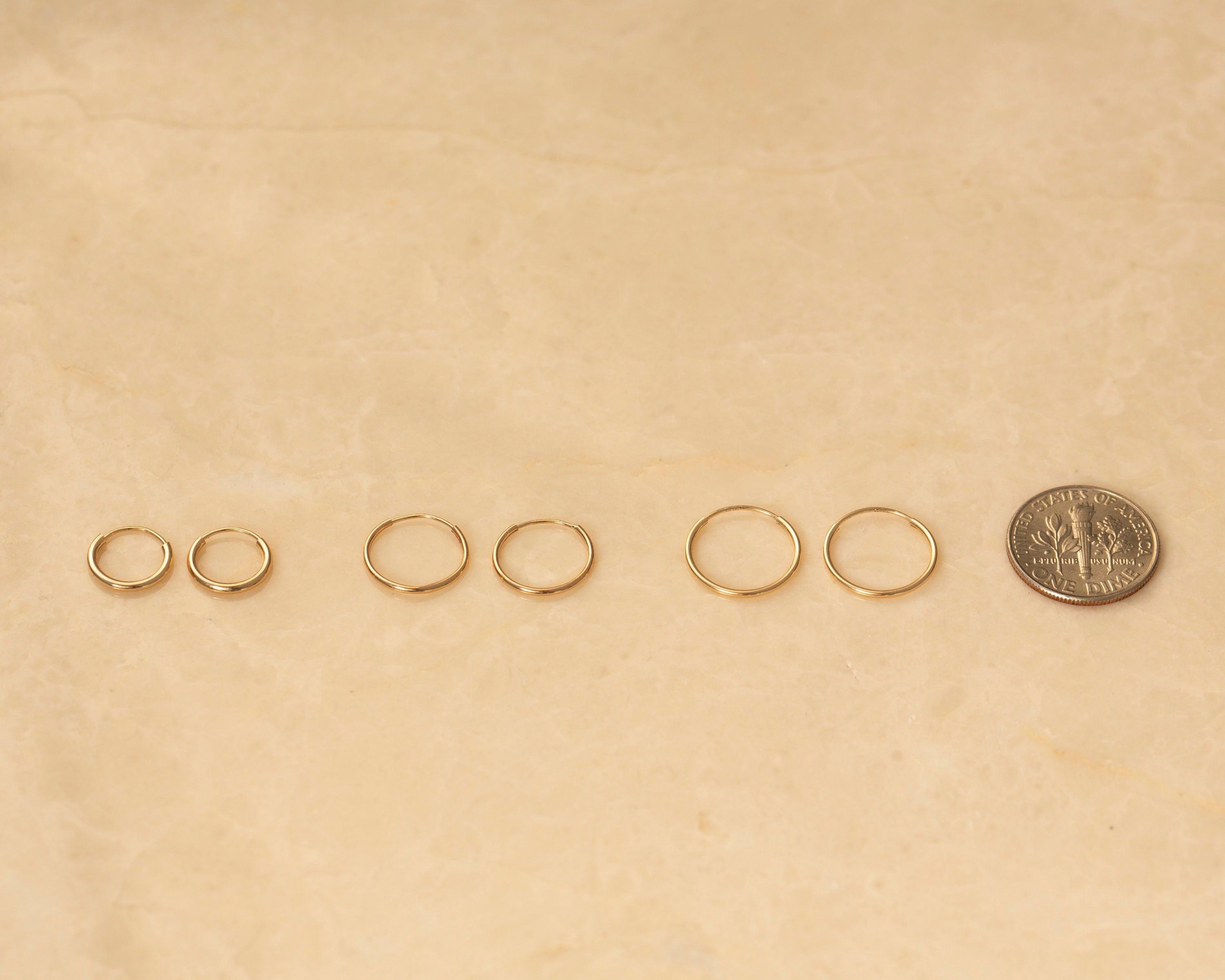 Chic 14K Solid Gold Endless Hoop Earrings - Elegant Tiny Huggie Hoops for Every Occasion.