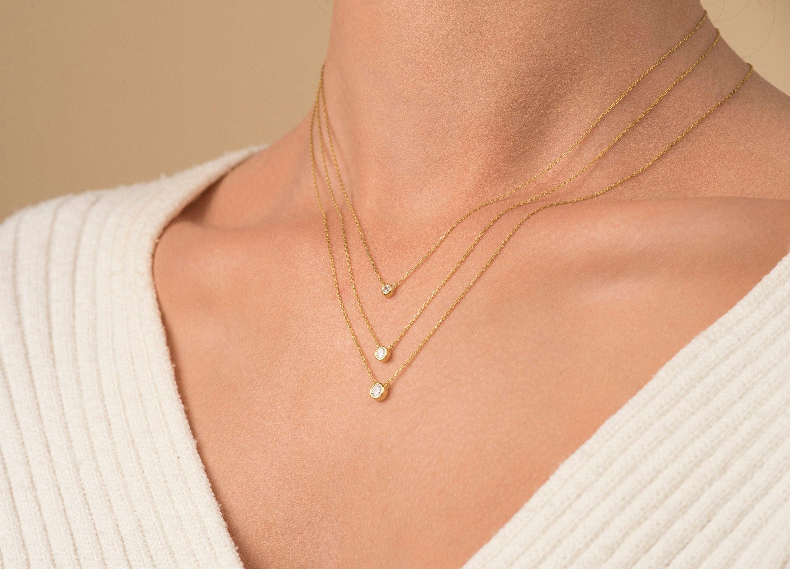 Elegant 14K Gold Diamond Solitaire Necklace - Minimalist Bezel Setting for Timeless Style.
