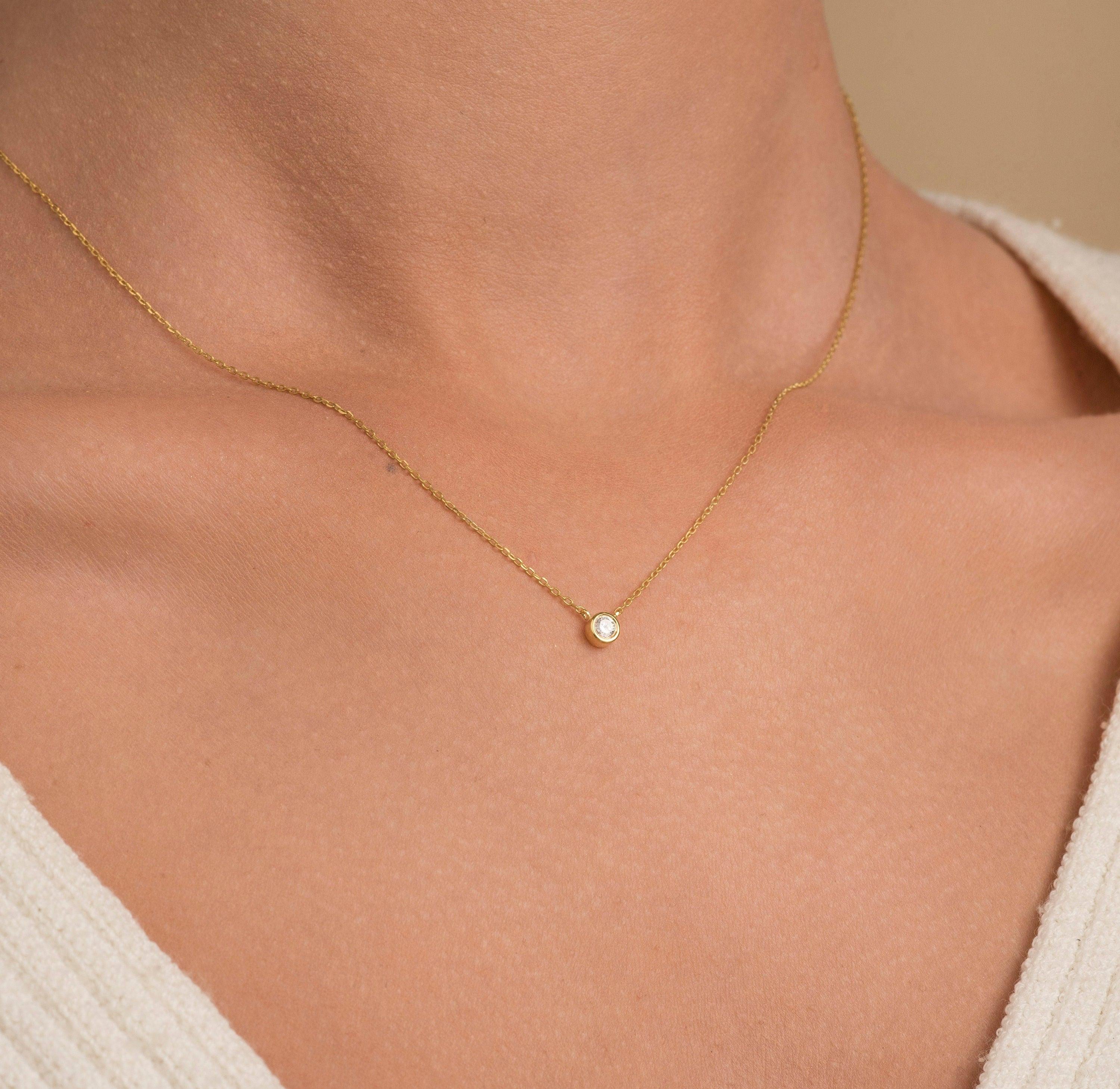 Elegant 14K Gold Diamond Solitaire Necklace - Minimalist Bezel Setting for Timeless Style.
