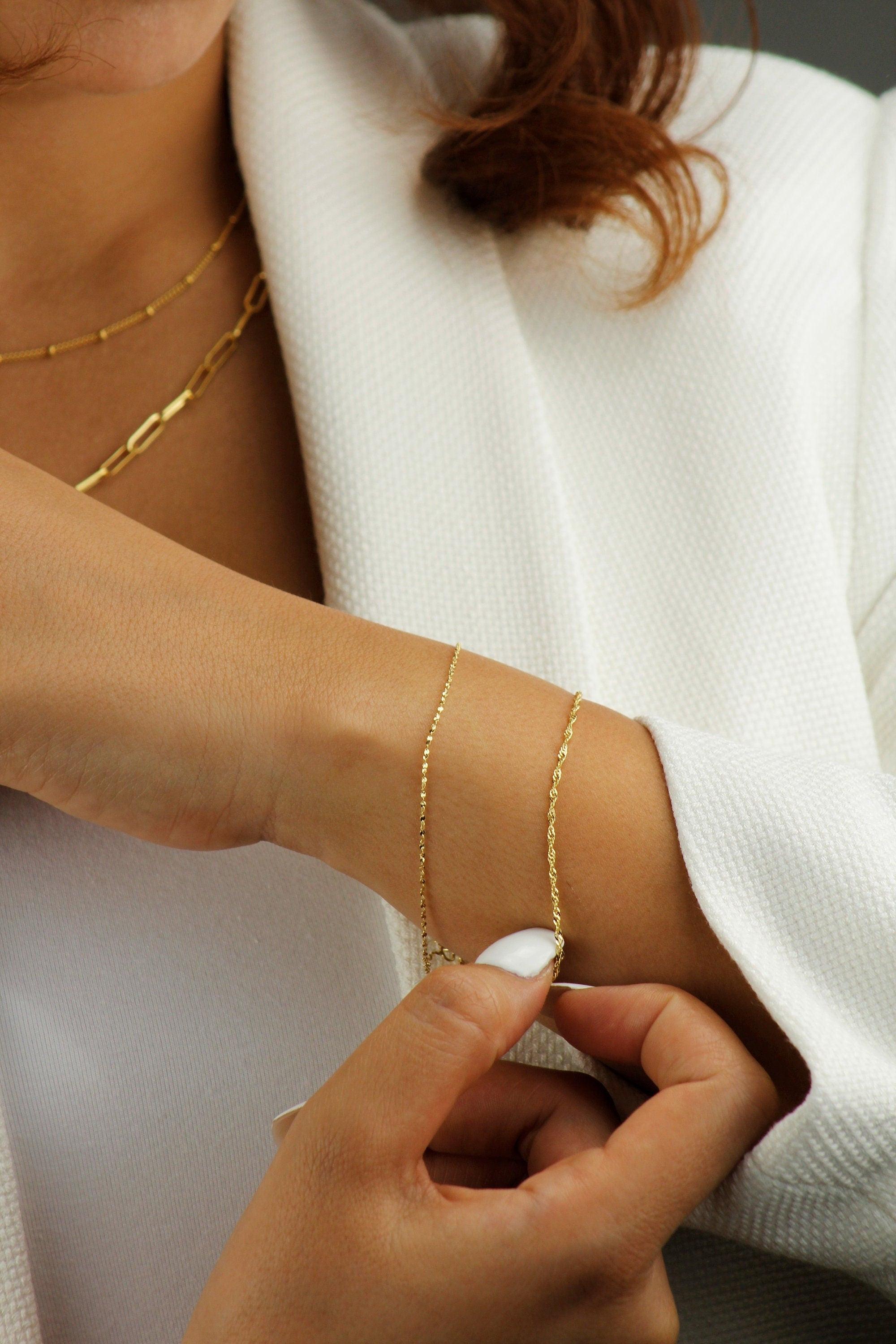 Elegant 10K Solid Gold Twisted Chain Bracelet - Dainty and Stackable Everyday Essential for Women.