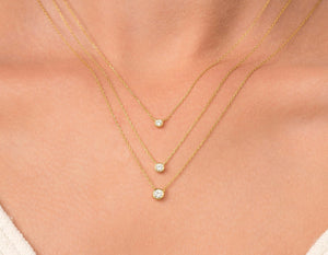 Elegant 14K Gold Diamond Solitaire Necklace - Minimalist Bezel Setting for Timeless Style.
