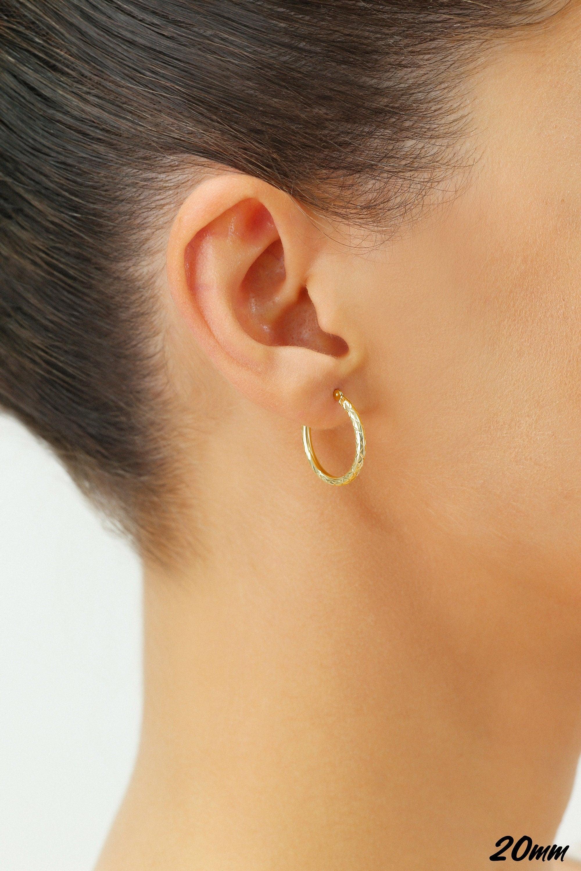 Stunning 14K Yellow Gold Diamond-Cut Hand Engraved "X-Pattern" Round Hoop Earrings - Available in Small, Medium, and Large by TILO Jewelry.