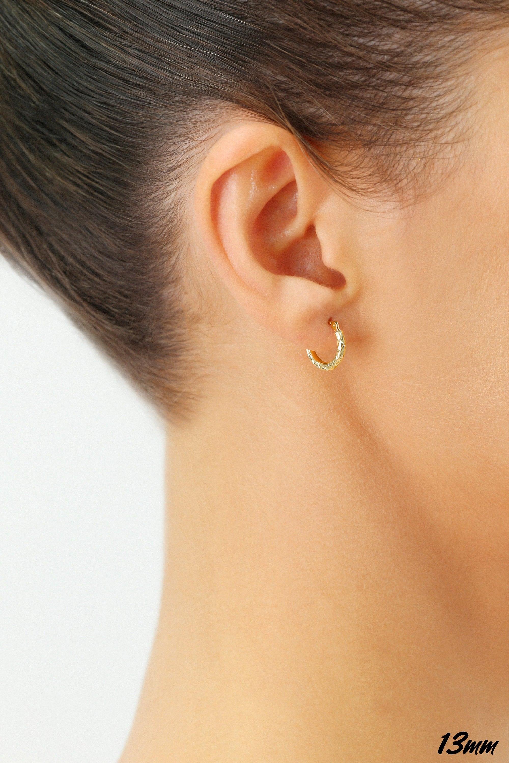 Stunning 14K Yellow Gold Diamond-Cut Hand Engraved "X-Pattern" Round Hoop Earrings - Available in Small, Medium, and Large by TILO Jewelry.