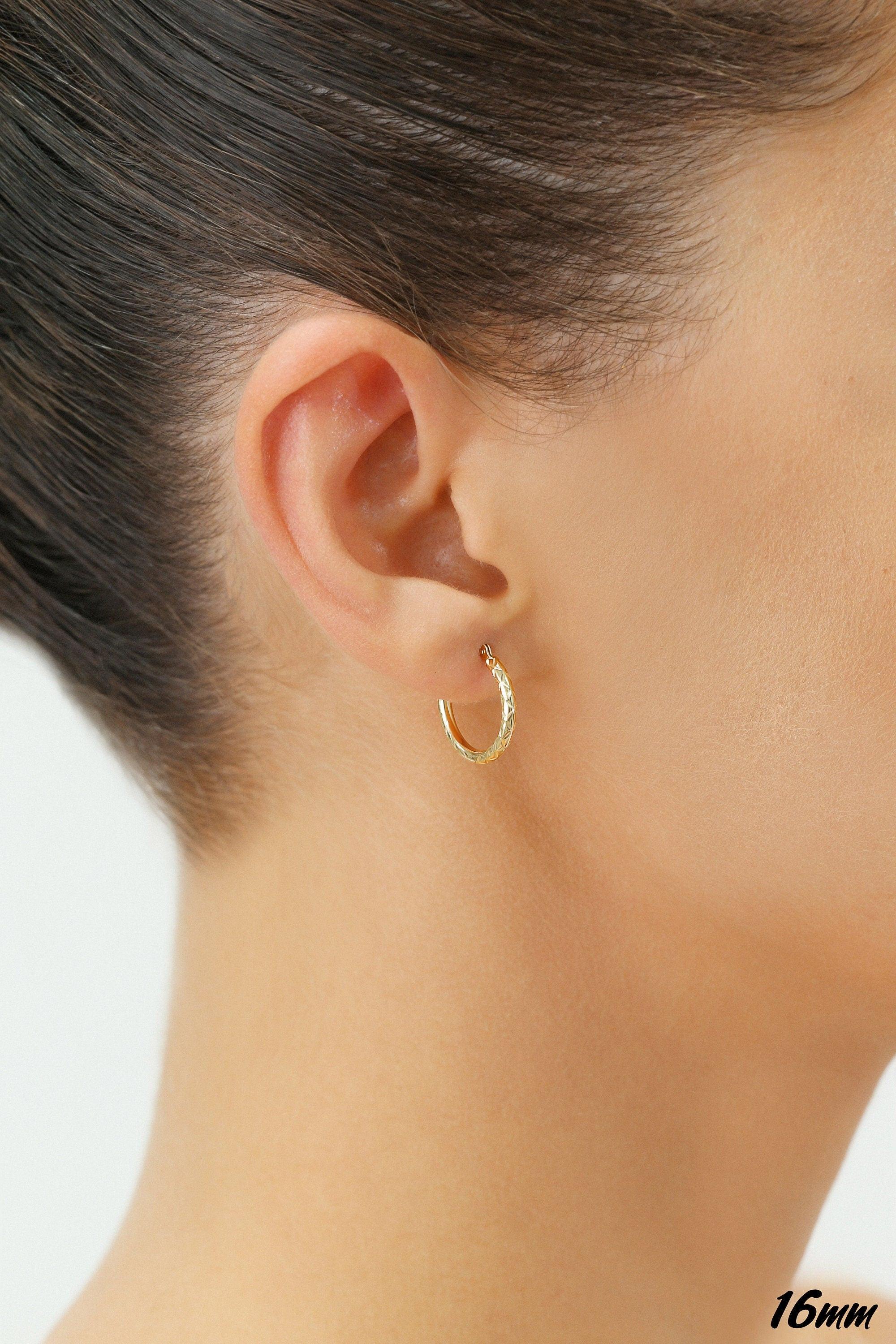Stunning 14K Yellow Gold Diamond-Cut Hand Engraved "X-Pattern" Round Hoop Earrings - Available in Small, Medium, and Large by TILO Jewelry.