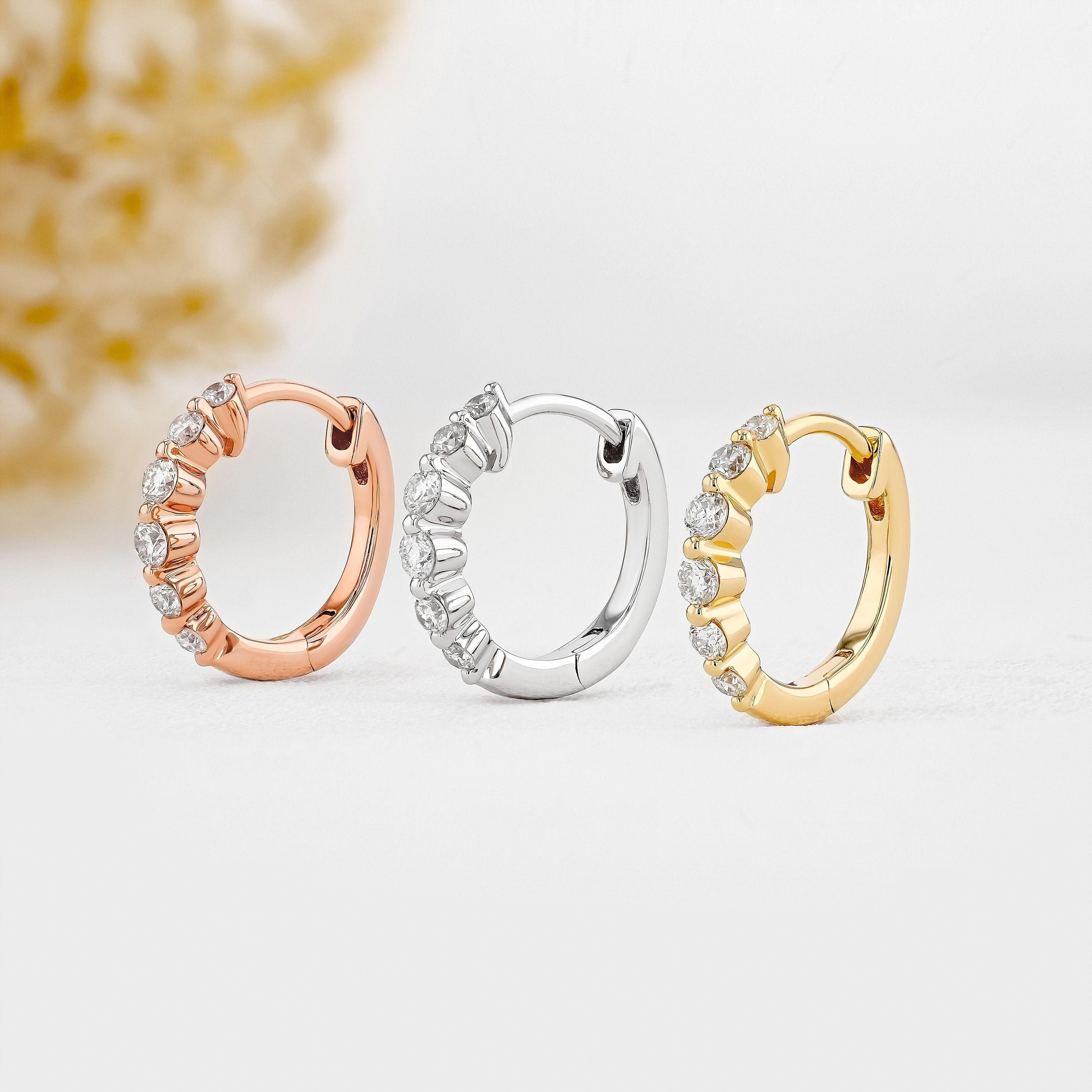 Stunning 14K Gold Diamond Graduated Huggie Hoop Earrings.