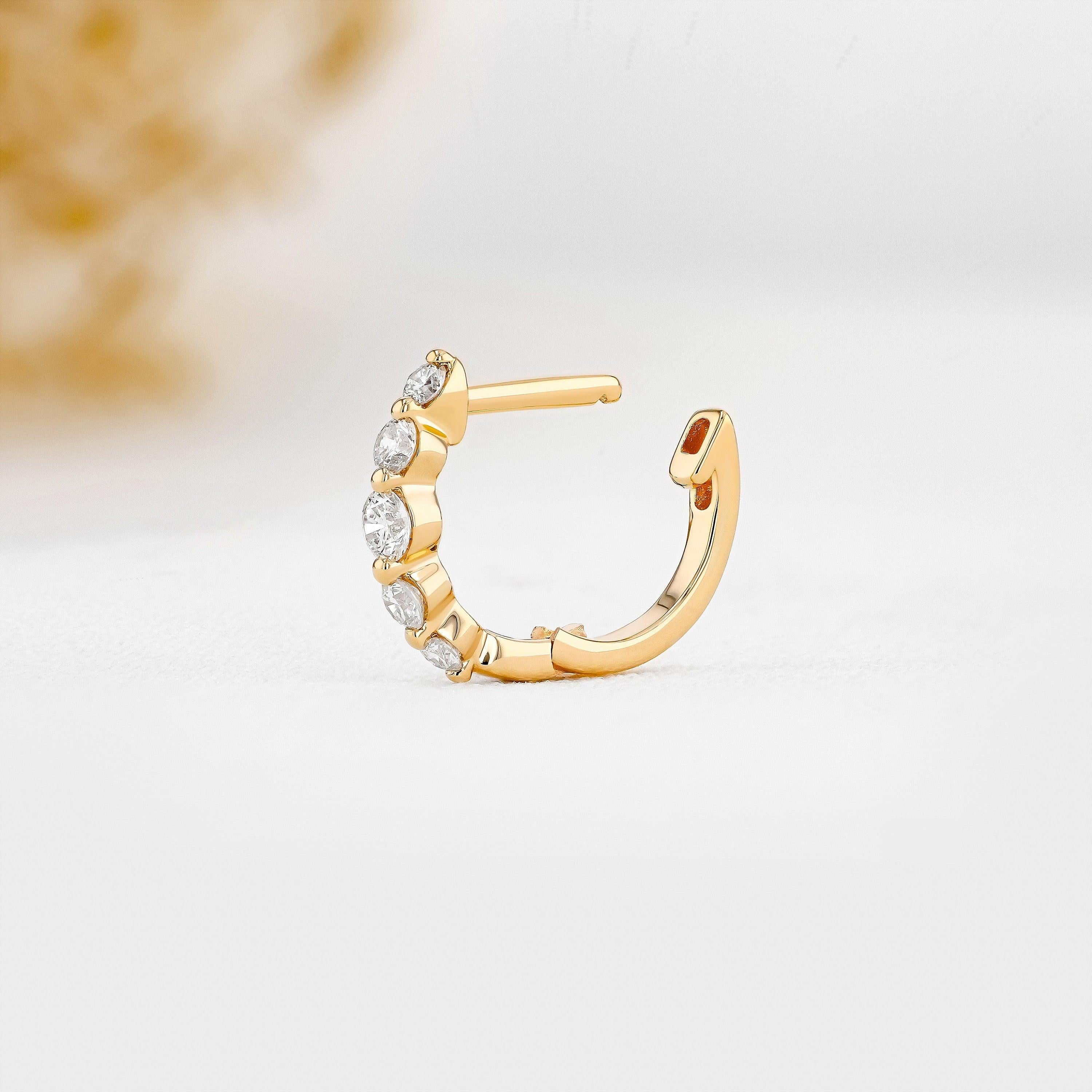 Stunning 14K Gold Diamond Graduated Huggie Hoop Earrings.