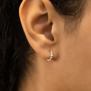 Stunning 14K Gold Diamond Graduated Huggie Hoop Earrings.