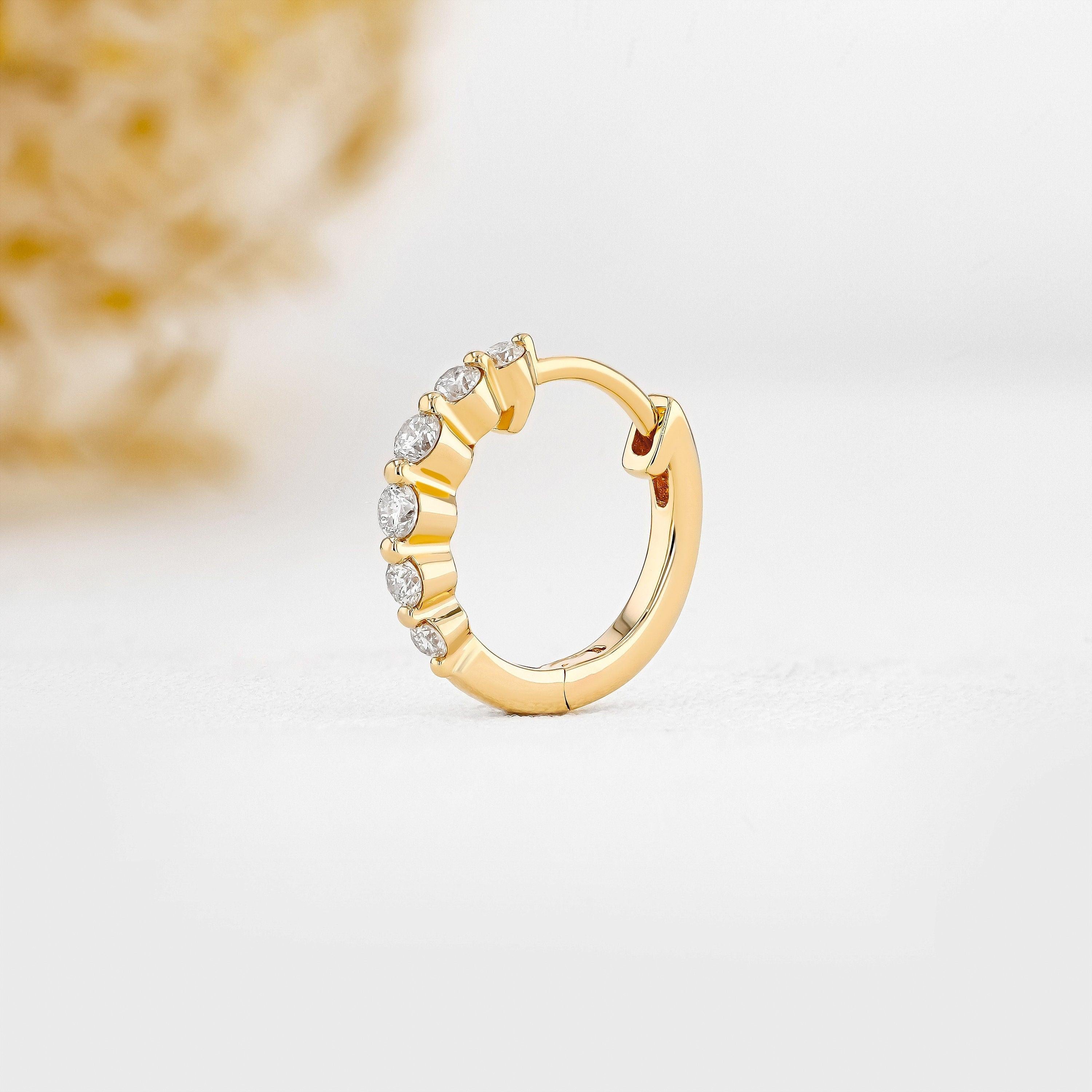 Stunning 14K Gold Diamond Graduated Huggie Hoop Earrings.