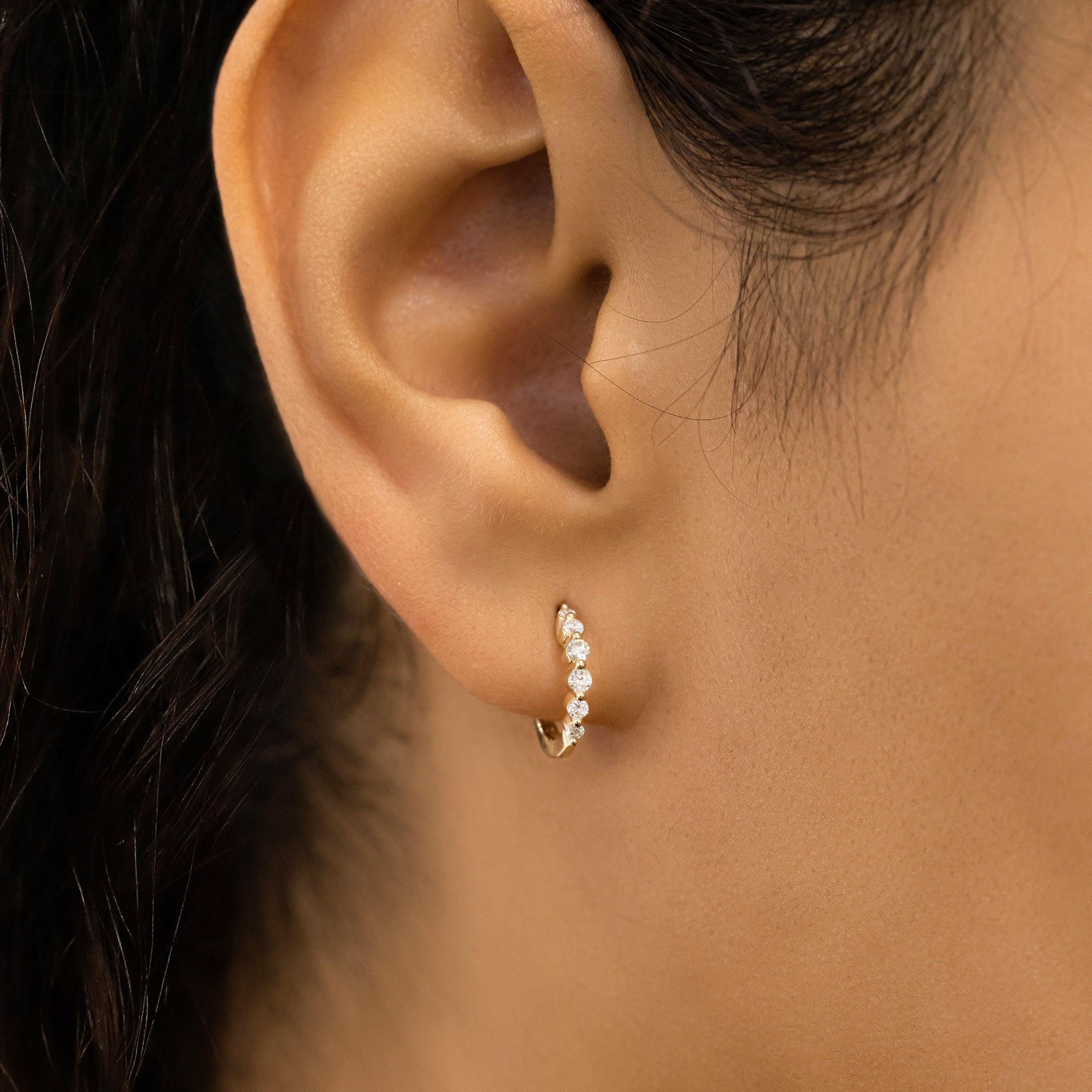 Stunning 14K Gold Diamond Graduated Huggie Hoop Earrings.