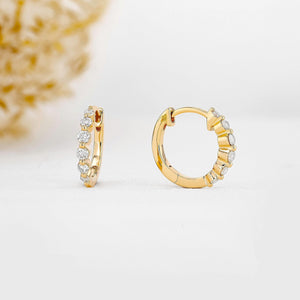 Stunning 14K Gold Diamond Graduated Huggie Hoop Earrings.